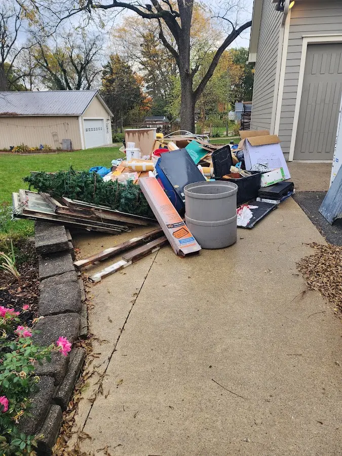 Dumpster being loaded with debris for 30 Yard Dumpster Rental in Wheatland